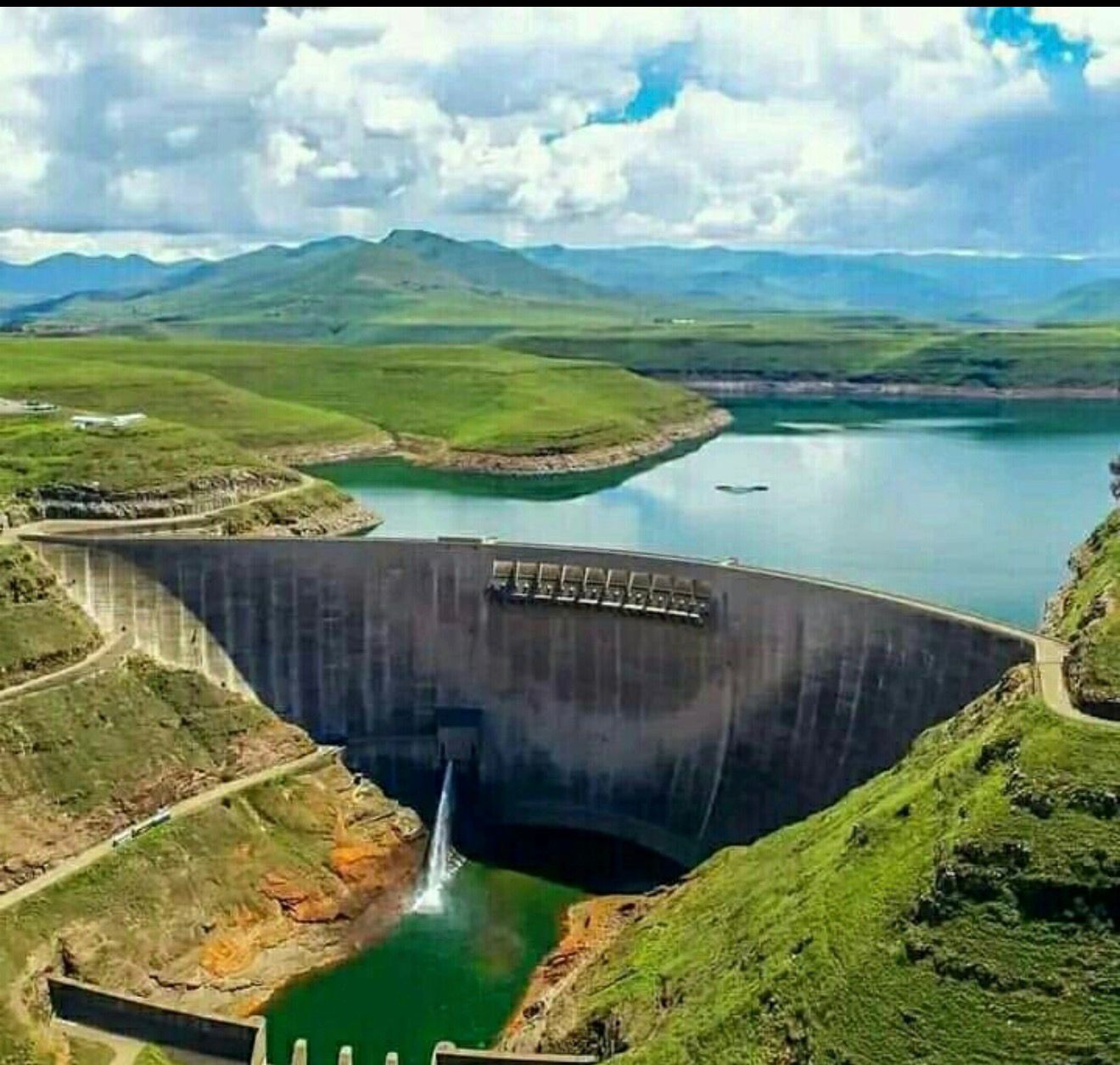 Mohale Dam - rockfill dam with spillway in green highlands
