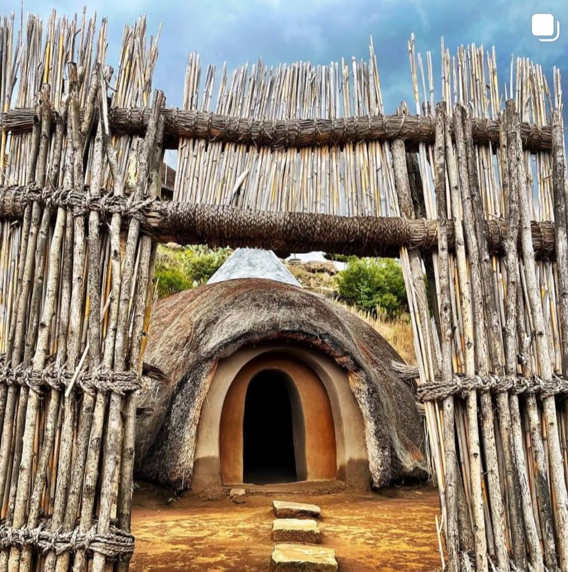 Traditional beehive hut entrance at Thaba Bosiu